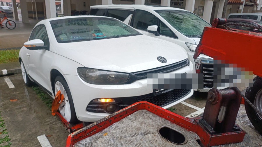 Volkswagen Scirocco being towed in for repair at our Singapore workshop.