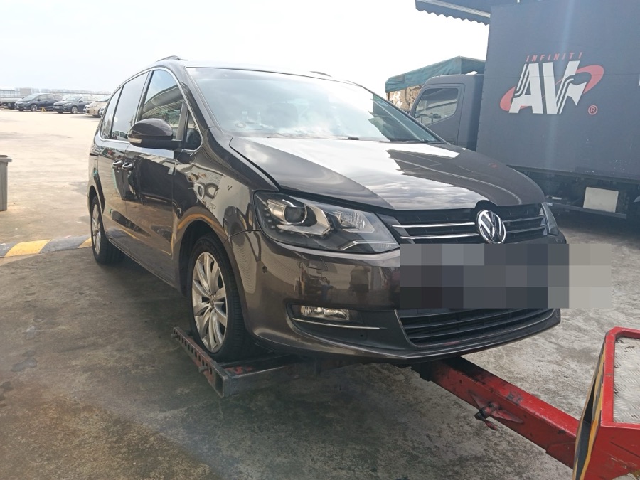 Volkswagen Sharan MPV on a tow dolly at our Singapore workshop