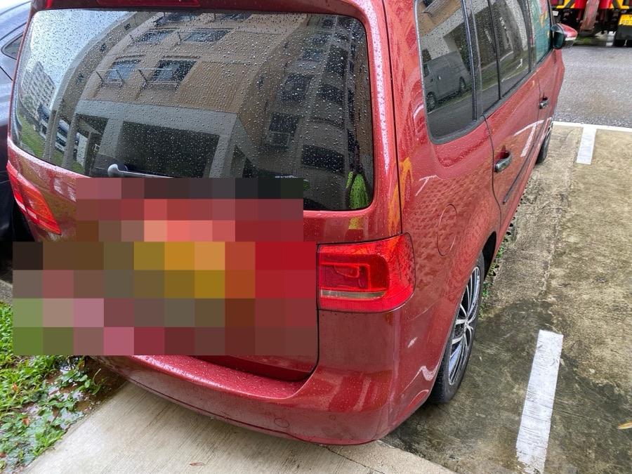 Volkswagen Touran arriving for repair at our Singapore workshop.