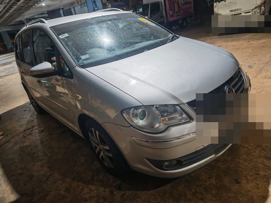 Silver Volkswagen Touran MPV at our Singapore workshop