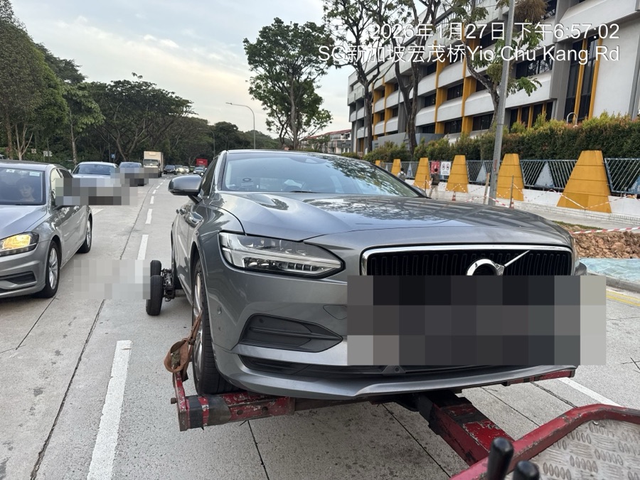 Volvo S90 being towed in for workshop service