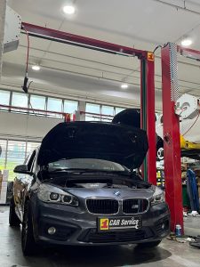 BMW Repair Auto Cooler - 1 Car Service Workshop - Gearbox, Aircon and Engine Specialist A sleek BMW parked in 1 Car Service Workshop following a preemptive auto cooler replacement to prevent transmission damage.